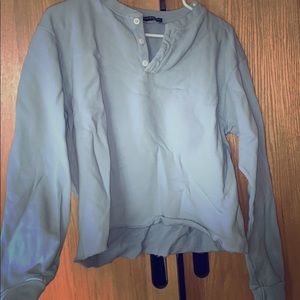 Cropped, light blue Brandy Melville sweater.